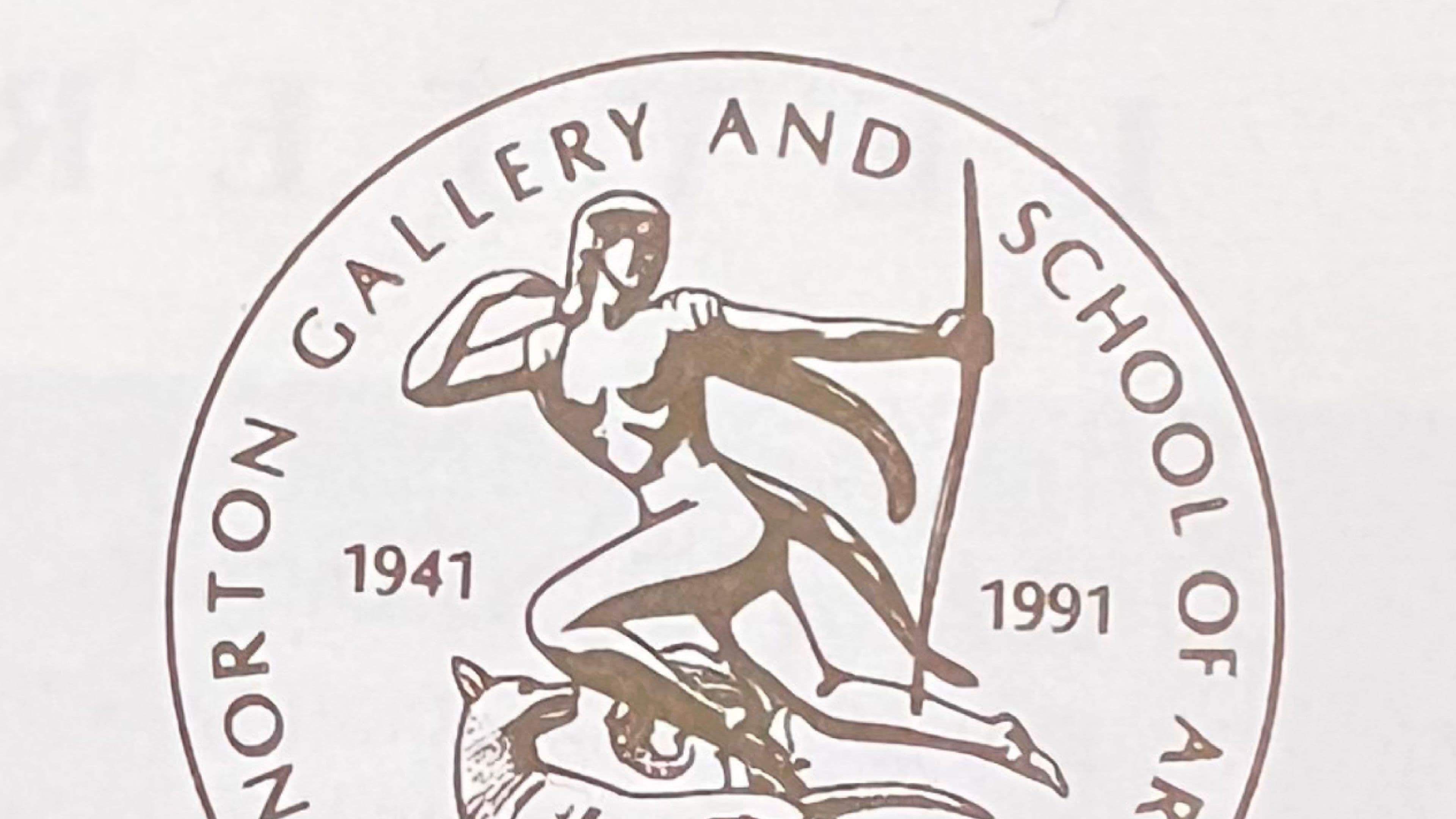 A close-up of a circular commemorative seal for the Norton Gallery and School of Art, featuring the Diana the huntress figure and marking the institution's 50th anniversary from 1941 to 1991.